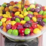 Image of candy in gumball type machine for Candy Themed Stationery Accessories blog post