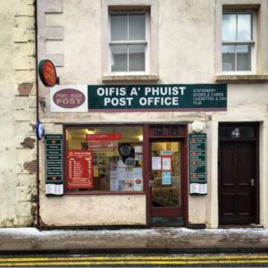 building in Portree, Scotland Tiny Post Office Employee Jax